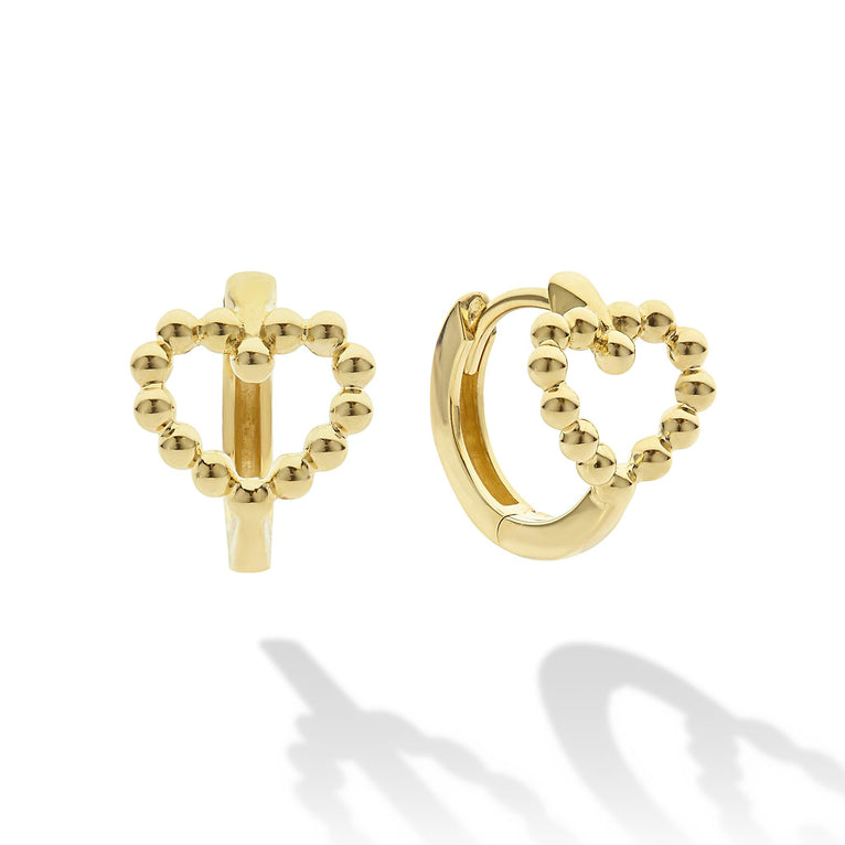 Heart-shaped gold huggie earrings, beaded design.