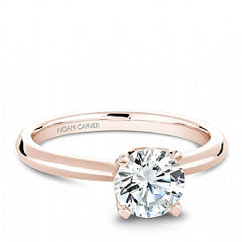 Rose gold ring with round diamond accents.