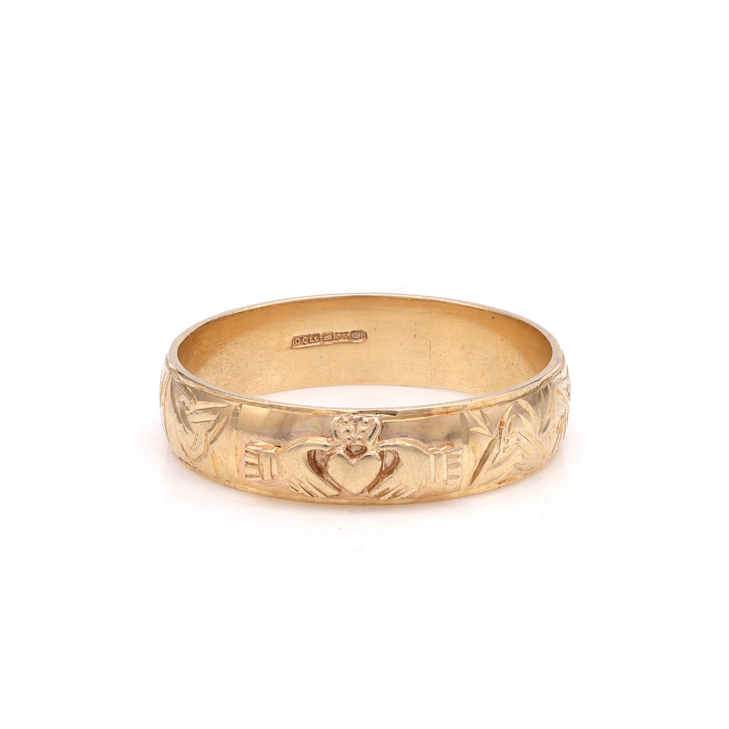 14K yellow gold carved band with heart motif.