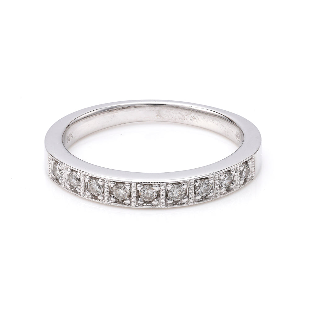 14K white gold band with round diamonds.