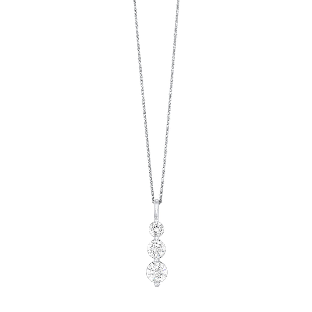 Three-stone diamond pendant in white gold.