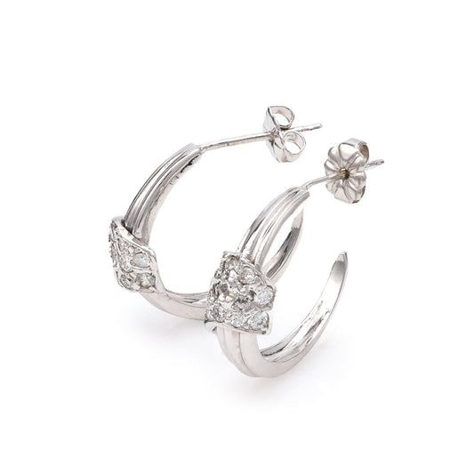 14K white gold diamond hoop earrings.