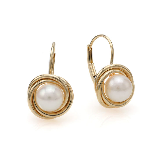 14K gold earrings with white Mabe pearls.