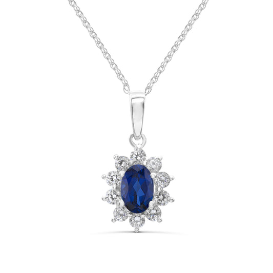 Oval sapphire pendant with diamond halo.