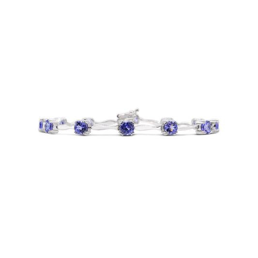 ReMARKable Designs Station Color Gemstone Ladies Bracelet in Sterling Silver White with 12 Oval Tanzanites 5.28ctw, Hidden Plunger Clasp