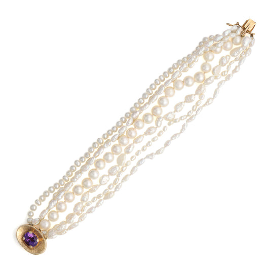 Pearl bracelet with amethyst centerpiece.