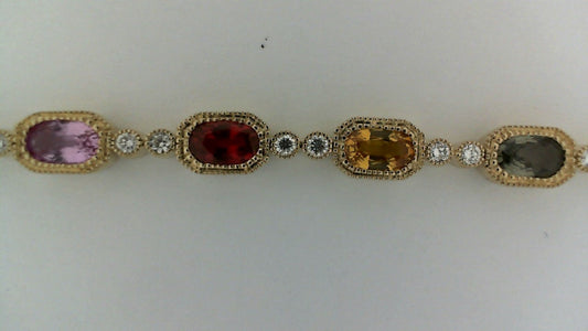 ReMARKable Designs Color Gemstone Bracelet in 14 Karat Yellow Gold with 17 Oval Sapphires 6.29ctw