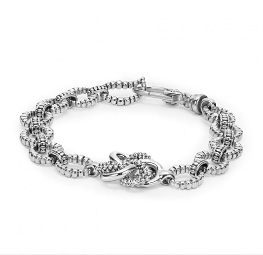 Sterling silver oval link bracelet, love knot design.