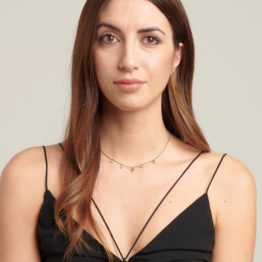 Yellow gold-tone necklace with simulated diamonds.