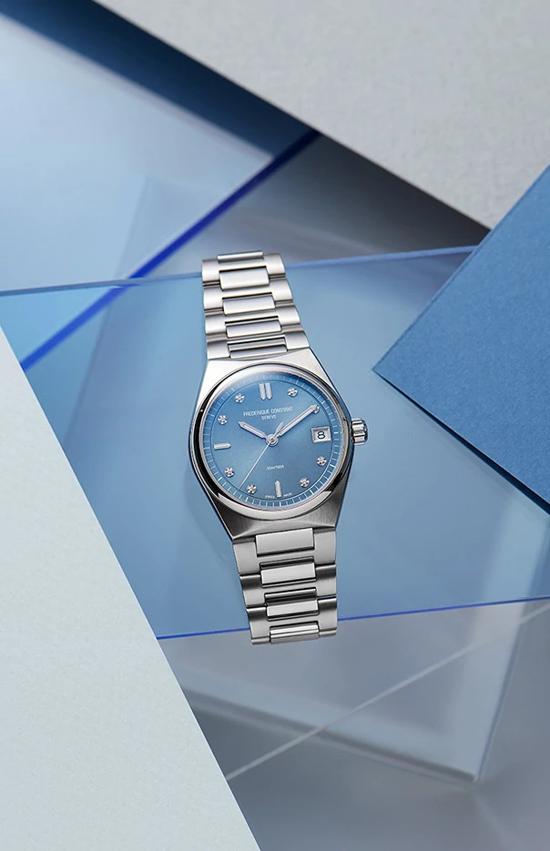 Blue dial stainless steel watch with diamonds.
