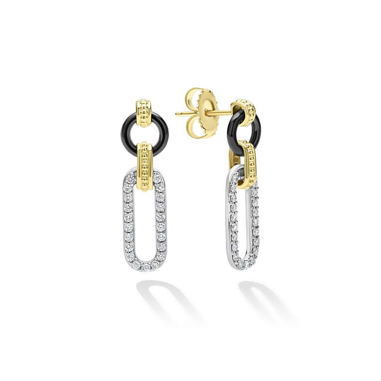 Sterling silver diamond drop earrings with gold accents.