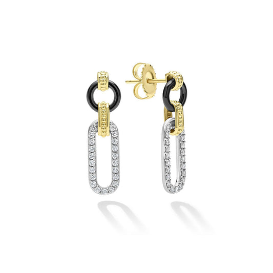 Sterling silver diamond drop earrings with gold accents.