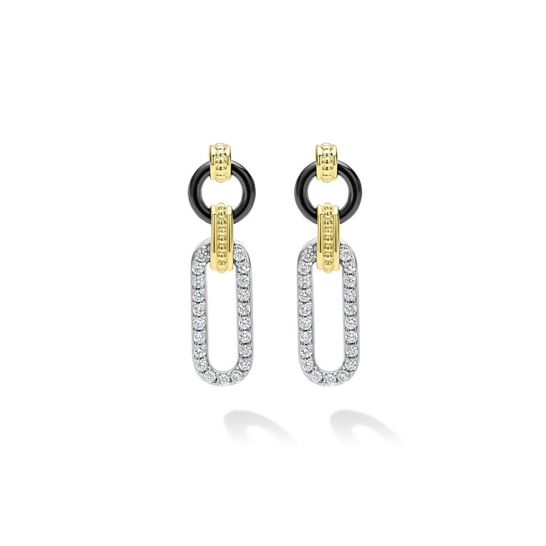 Diamond drop earrings with gold and silver accents.
