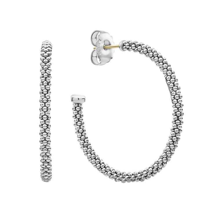 Sterling silver textured large hoop earrings.