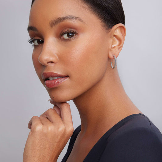 Sterling silver beaded medium hoop earrings.