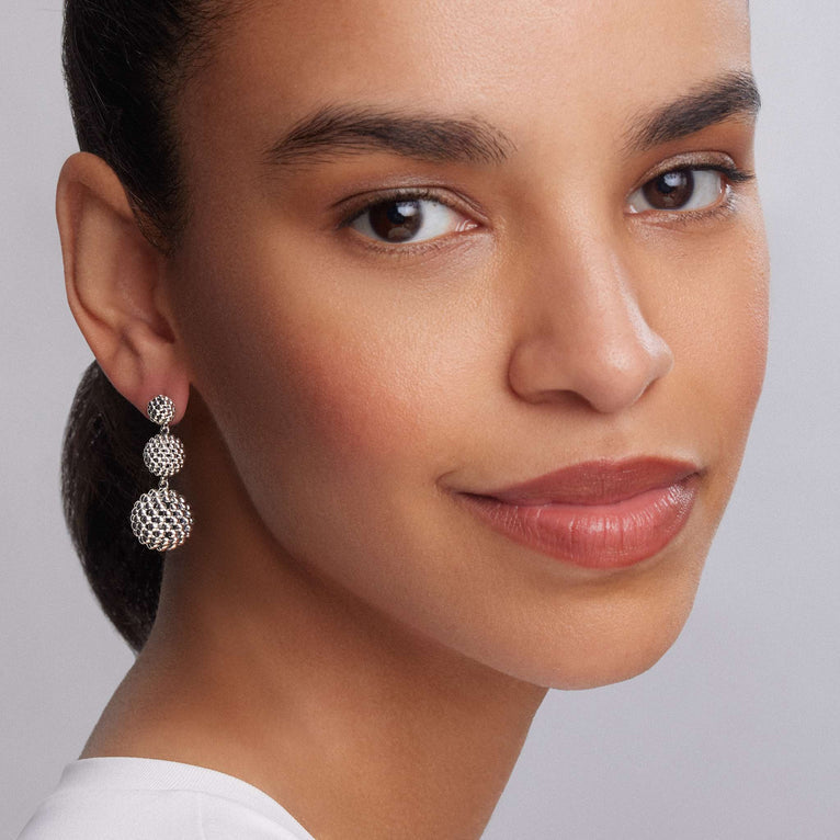 Silver textured drop earrings.
