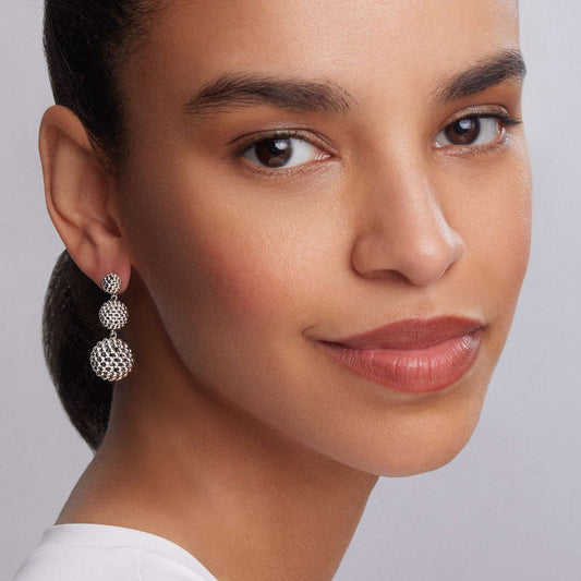 Silver textured drop earrings.