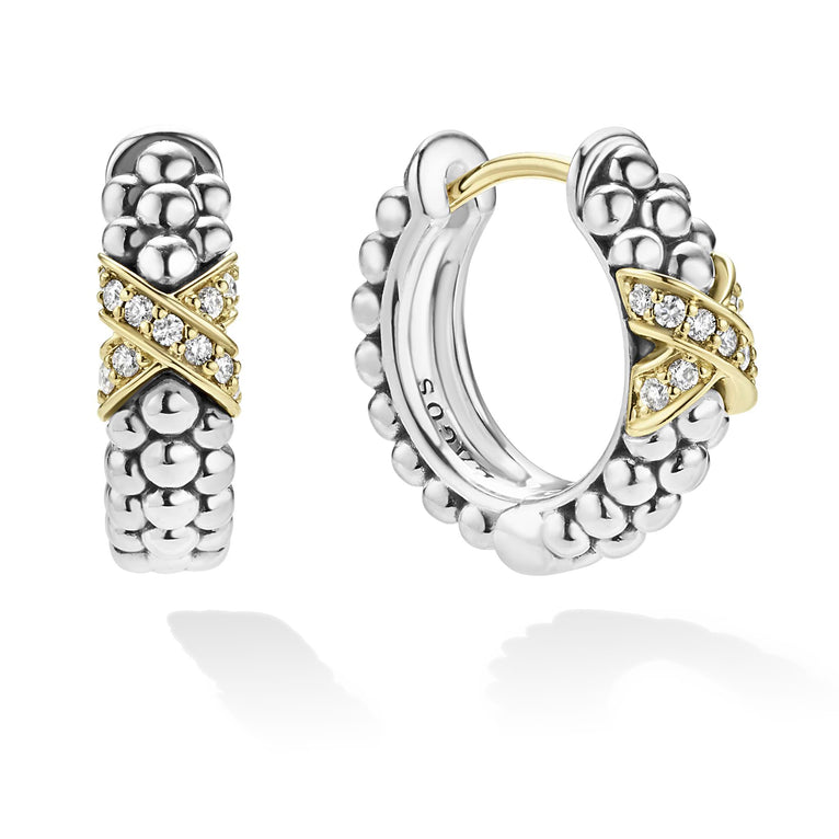 Sterling silver gold diamond huggie earrings.