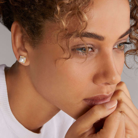 Pearl diamond stud earrings in silver.