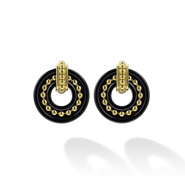 Black and gold circular stud earrings.