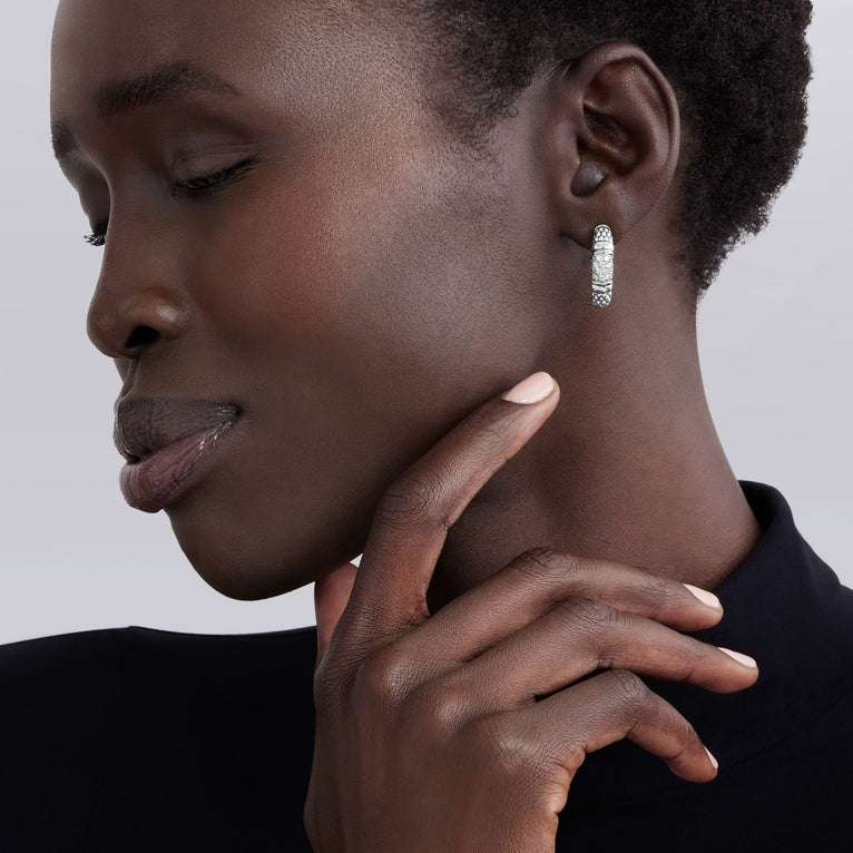 Sterling silver hoop earrings with diamonds.