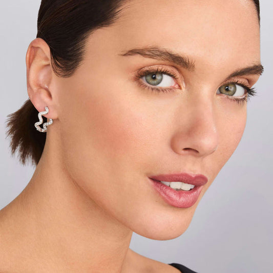 Sterling silver hoop earrings with diamonds.