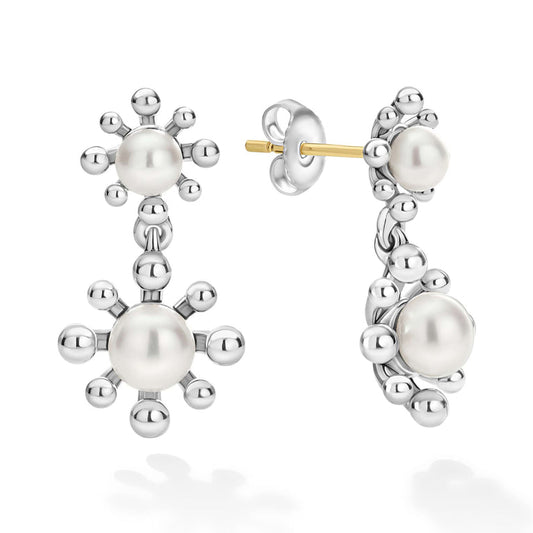 Sterling silver earrings with pearls and gold accents.