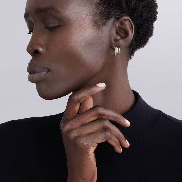Sterling silver and gold small hoops.