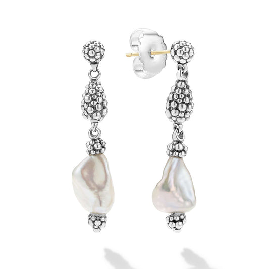 Baroque pearl drop earrings with silver accents.