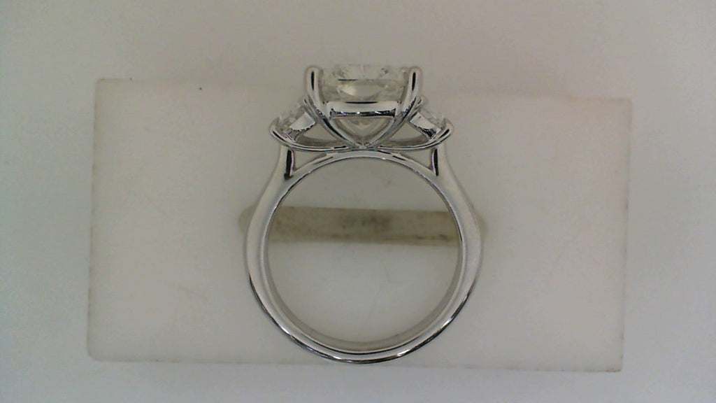 Three-stone white gold engagement ring.