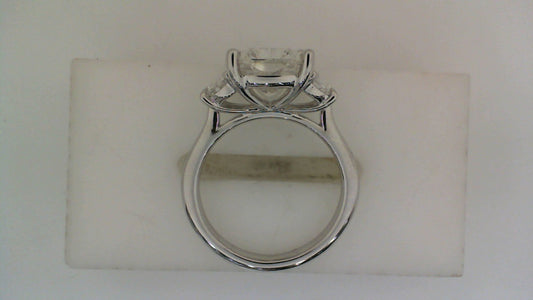 Three-stone white gold engagement ring.