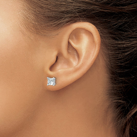 Princess-cut diamond stud earrings.