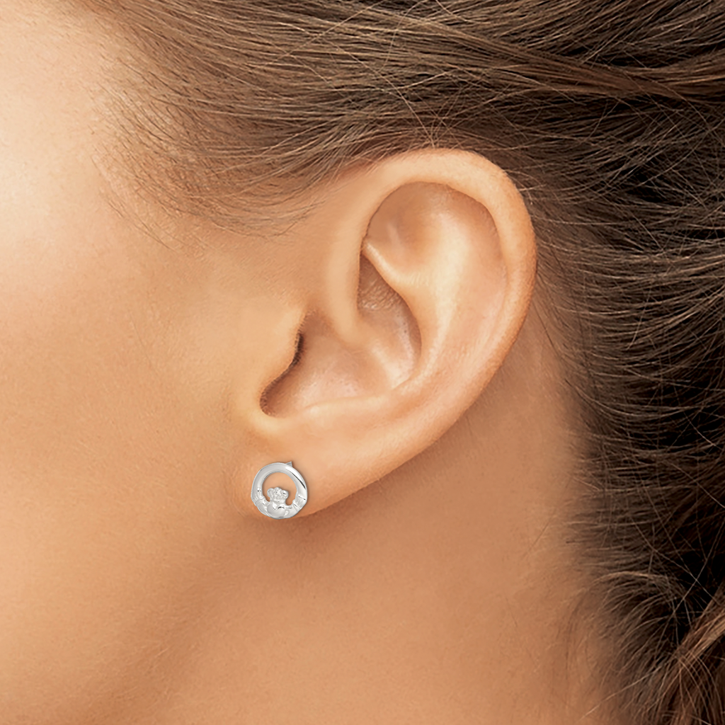 Sterling silver circular stud earrings.