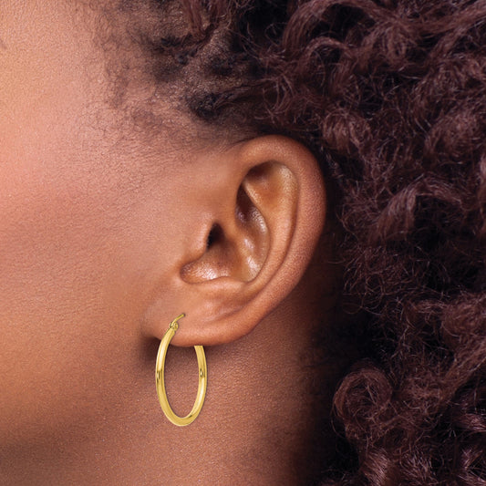 14K yellow gold small hoop earrings.