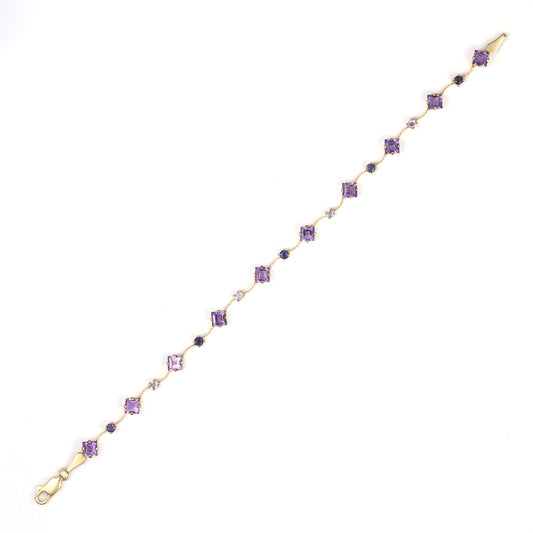 14K gold bracelet with princess amethysts, iolites.