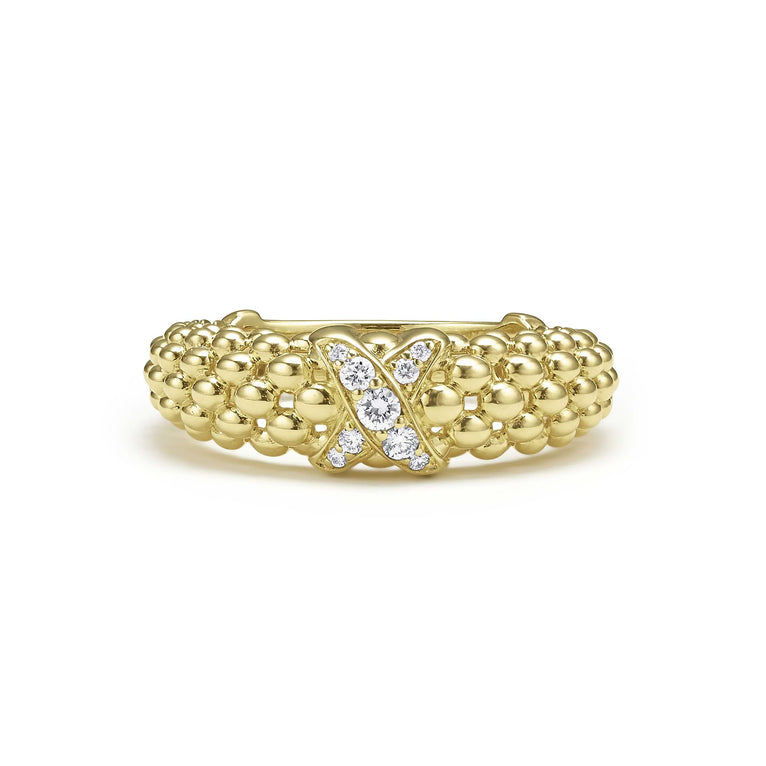 Gold ring with diamond-studded X design.