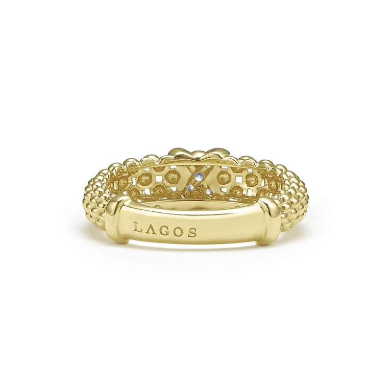 Gold ring with round diamond accents.