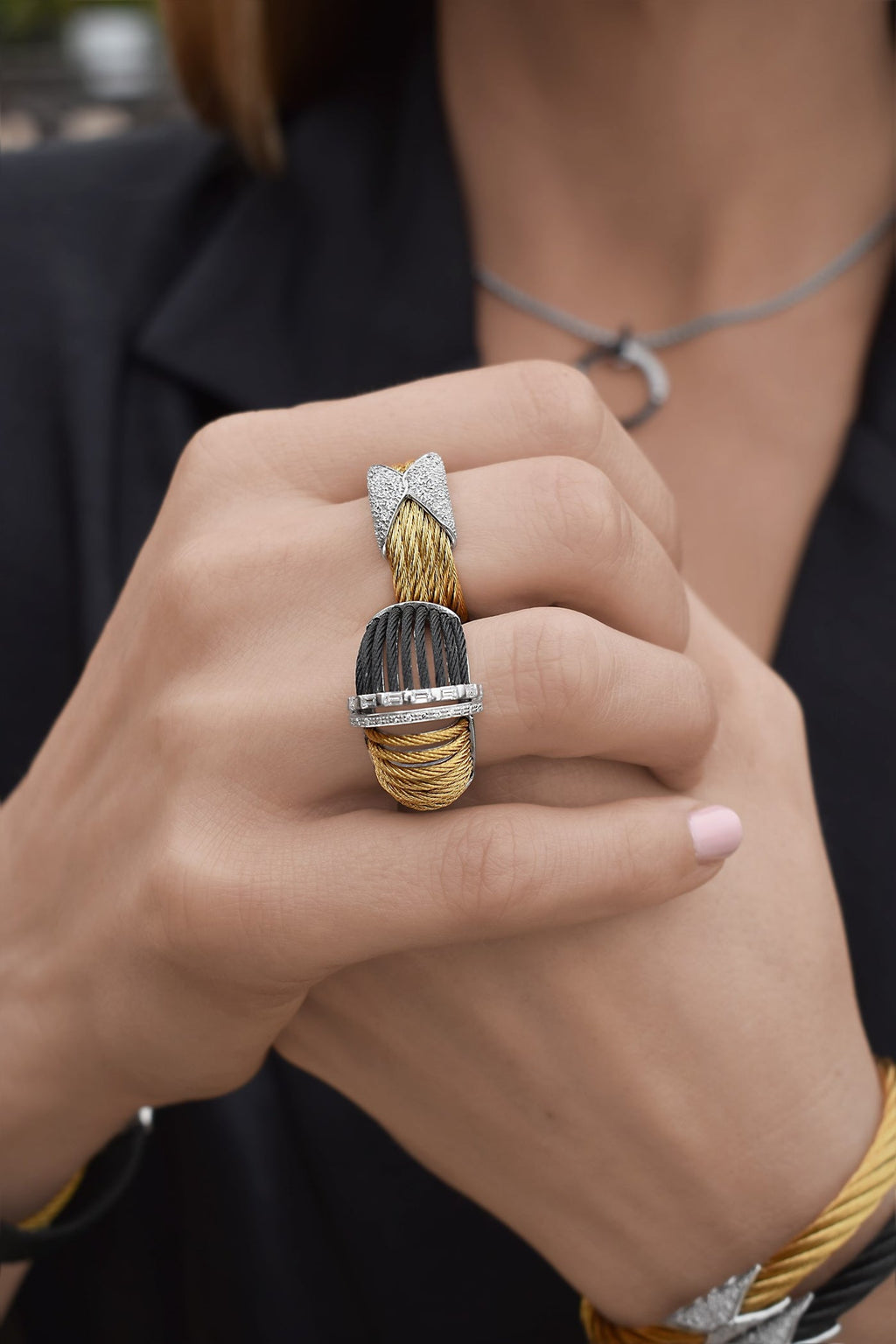 Stainless steel ring with yellow gold accents.