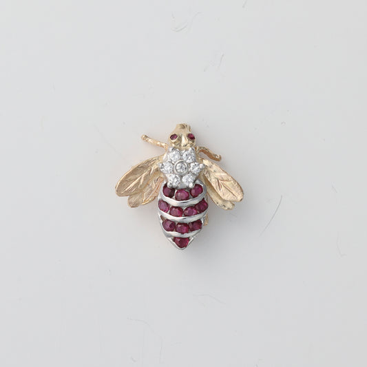 Ruby and diamond bumble bee pin.