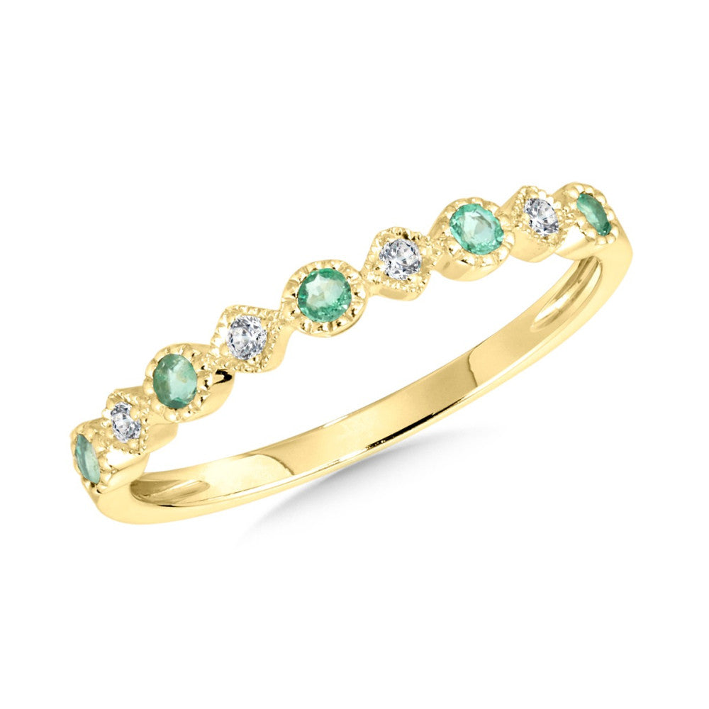 Emerald and diamond ring in yellow gold.