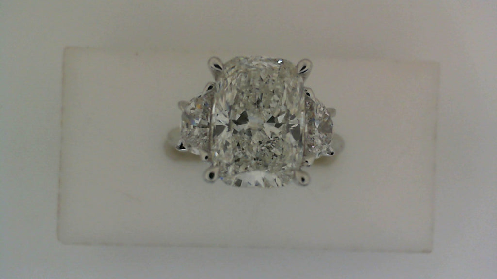 Three-stone white gold engagement ring.