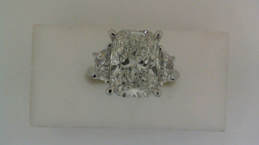 Three-stone white gold engagement ring.
