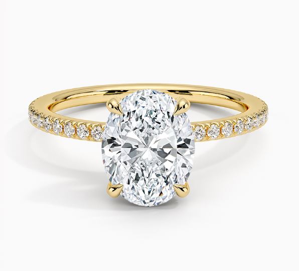 Oval diamond yellow gold engagement ring.