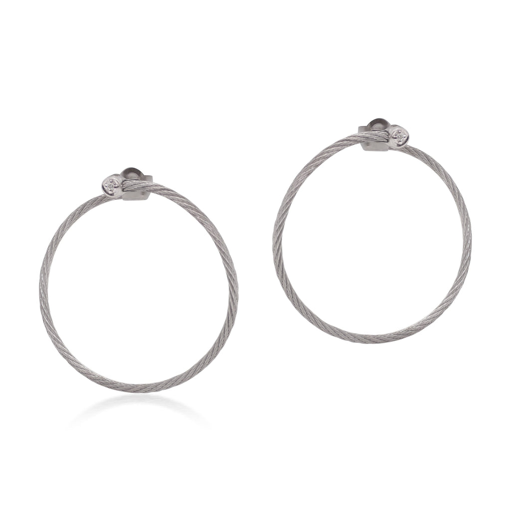 Large grey hoop earrings with round diamonds.