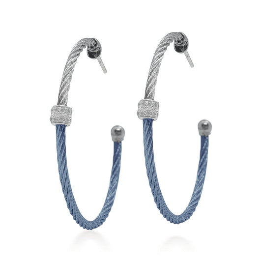 Blue and silver hoop earrings with diamonds.
