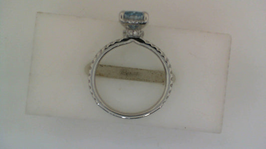Blue diamond engagement ring, white gold band.