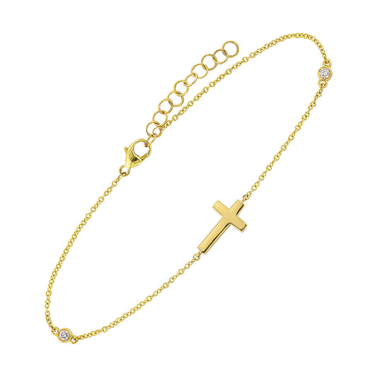 Gold bracelet with cross and diamond accents.