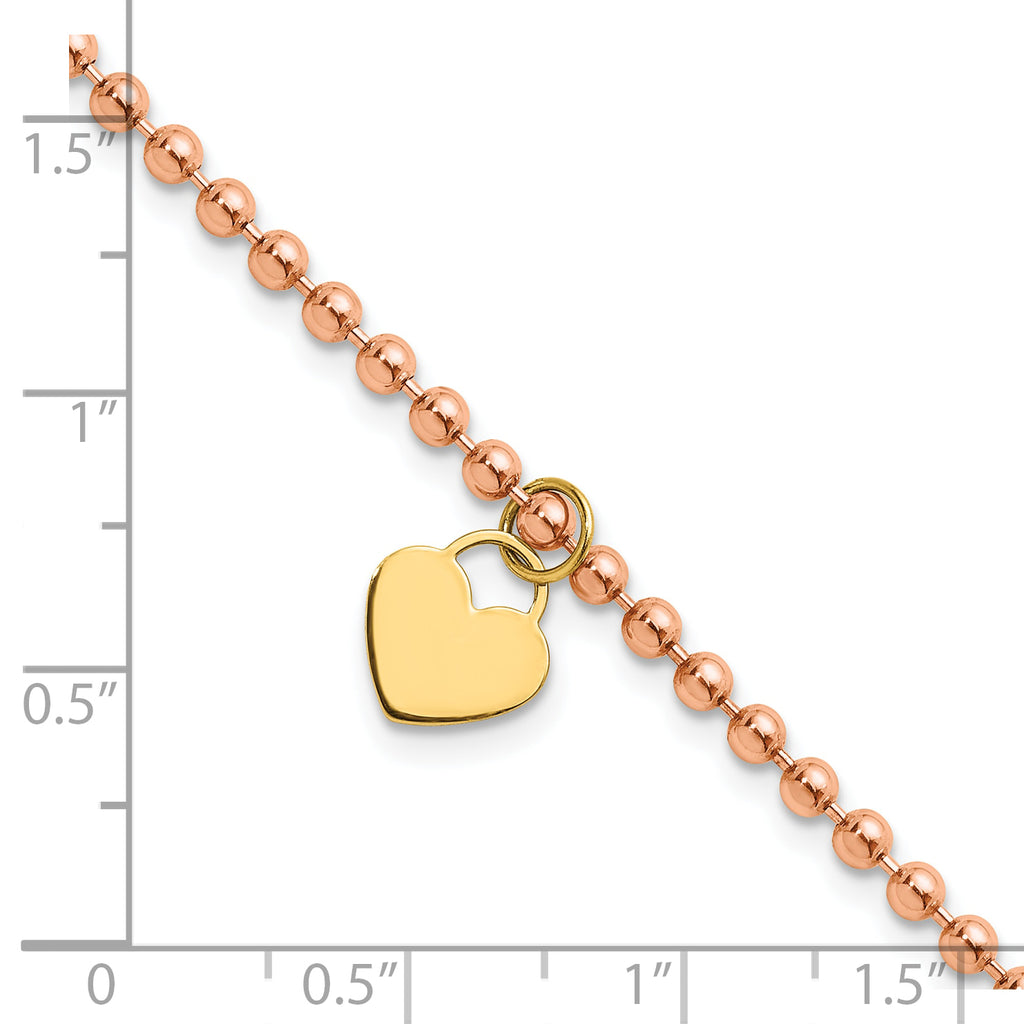 Heart bracelet in yellow and rose gold.