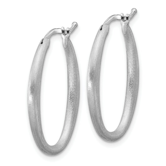 Brushed sterling silver oval hoop earrings.