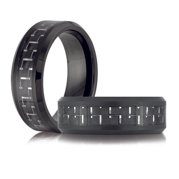 Black tungsten carbide band with carved design.